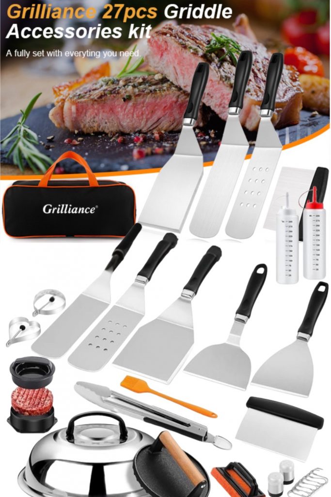 A comprehensive 27-piece stainless steel griddle accessories kit including spatulas, scrapers, egg rings, and squeeze bottles arranged neatly for a professional outdoor cooking setup.
